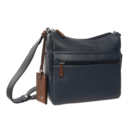 Seven Days Bloodwood Vegan Leather Crossbody in dark blue with front zip, brown tag, and adjustable strap.