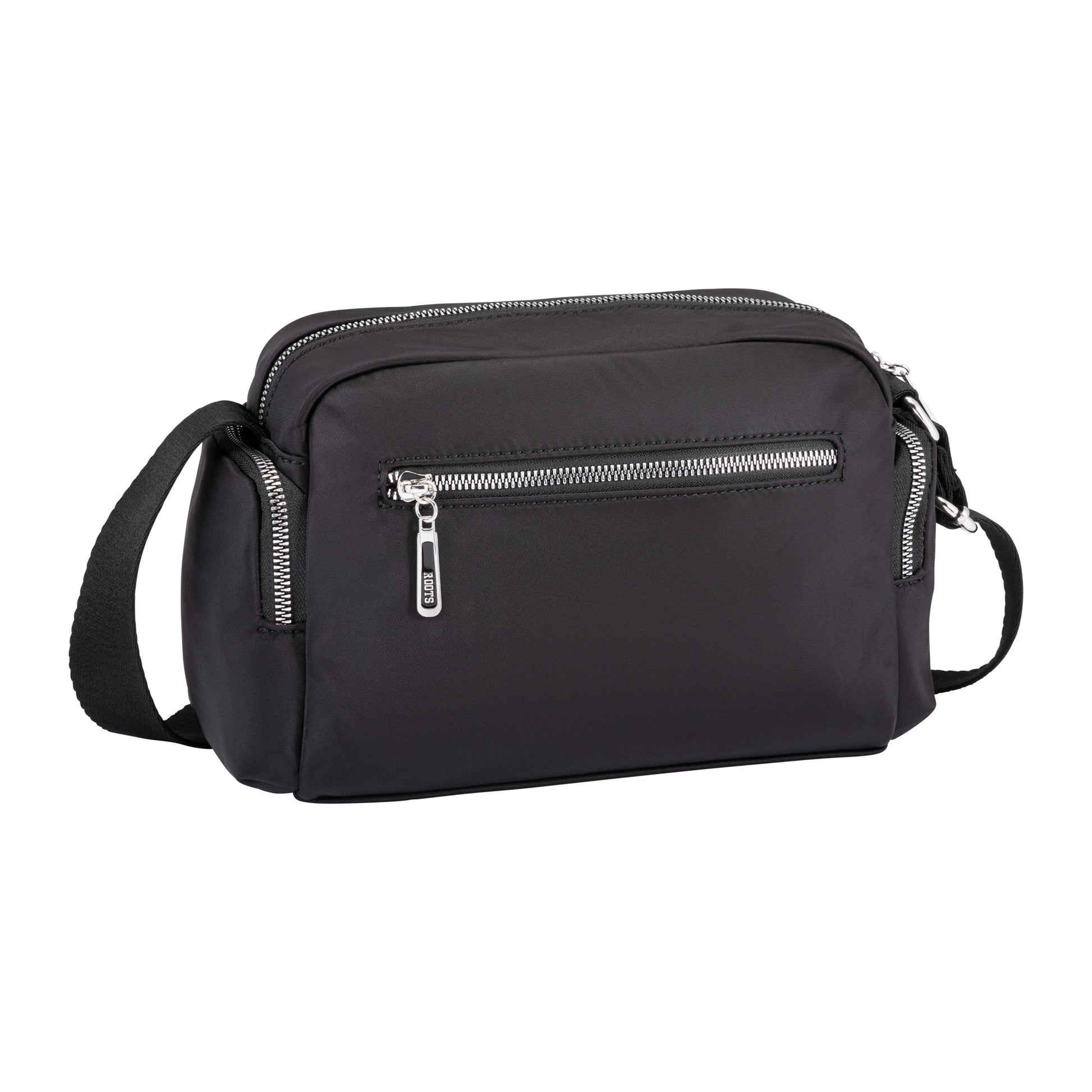 The Roots Ally Camera Crossbody is a black rectangular bag with silver zippers and an adjustable shoulder strap.
