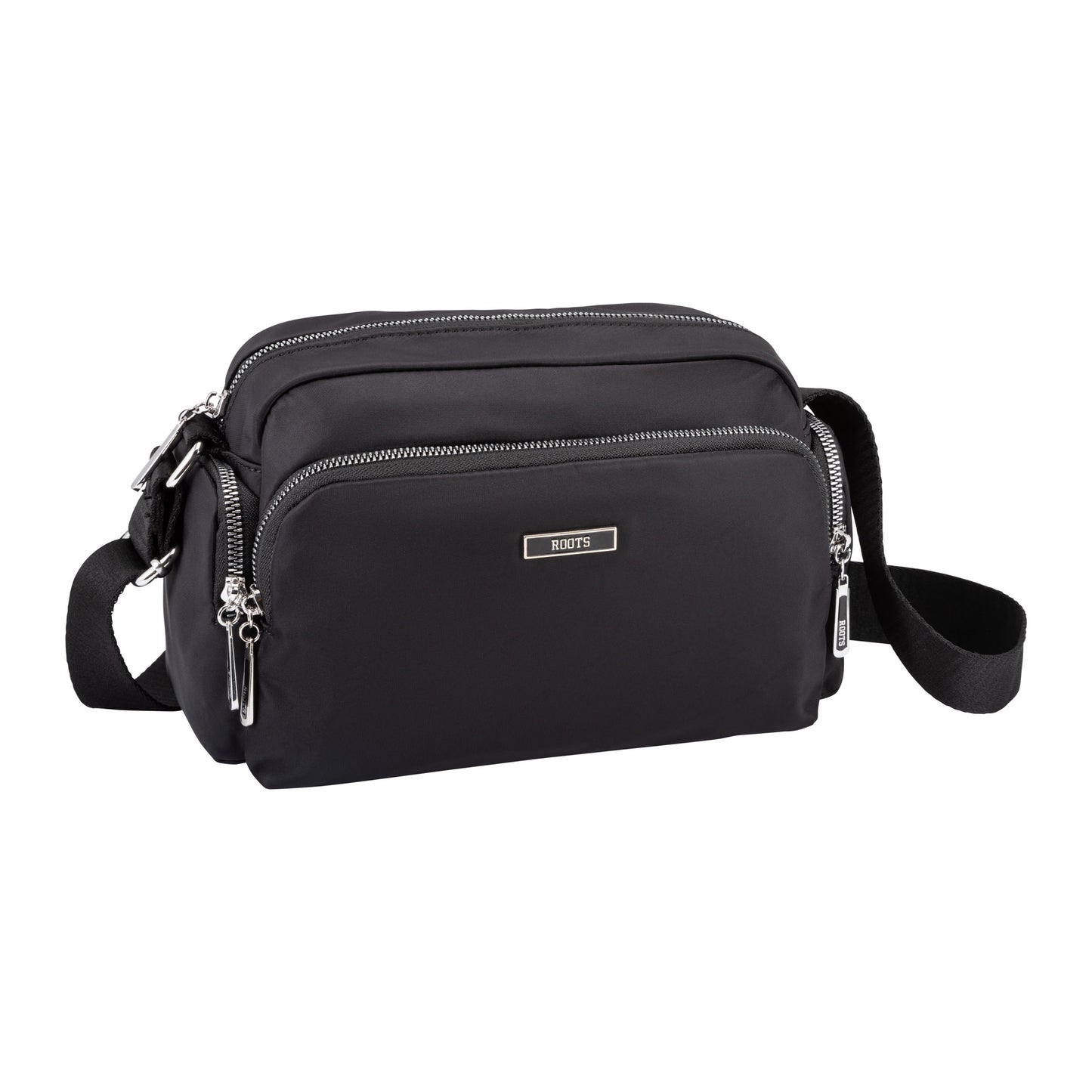 Black Roots Ally Camera Crossbody by Roots with pockets and adjustable strap, shown on a white background.