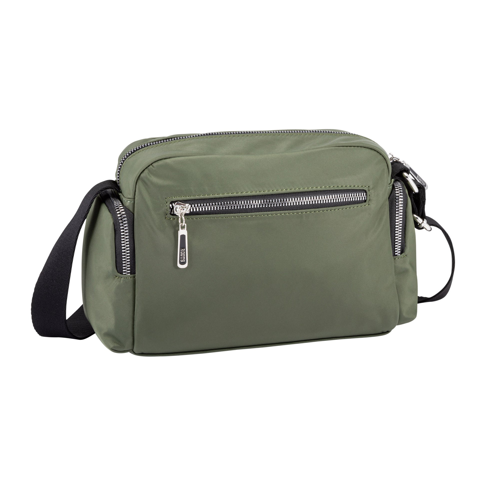 Roots Ally Camera Crossbody by Roots in khaki with silver zippers, front pocket, and adjustable strap.