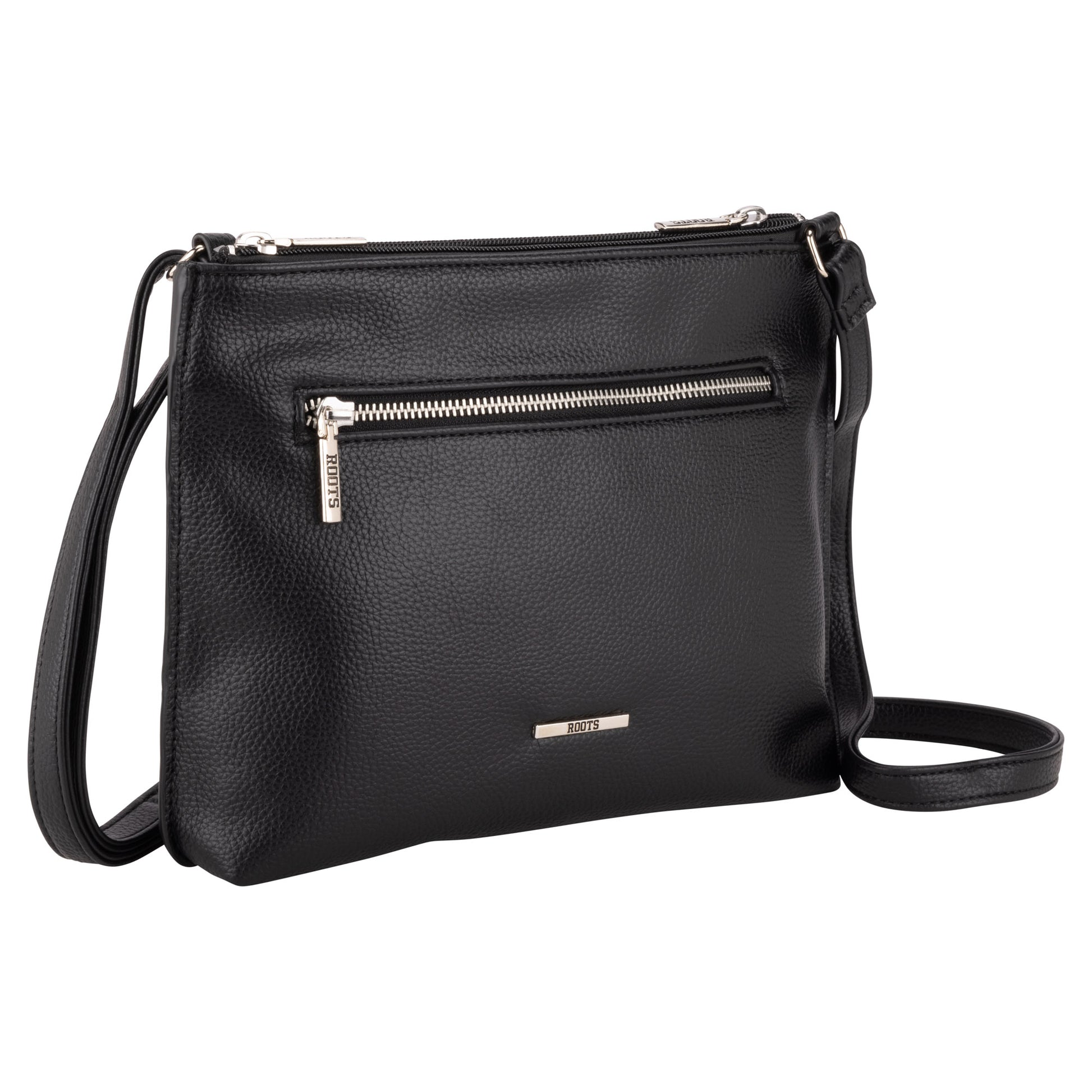 Roots 3-Compartment Crossbody by Roots in black leather with front zip pocket, shown on a white background.