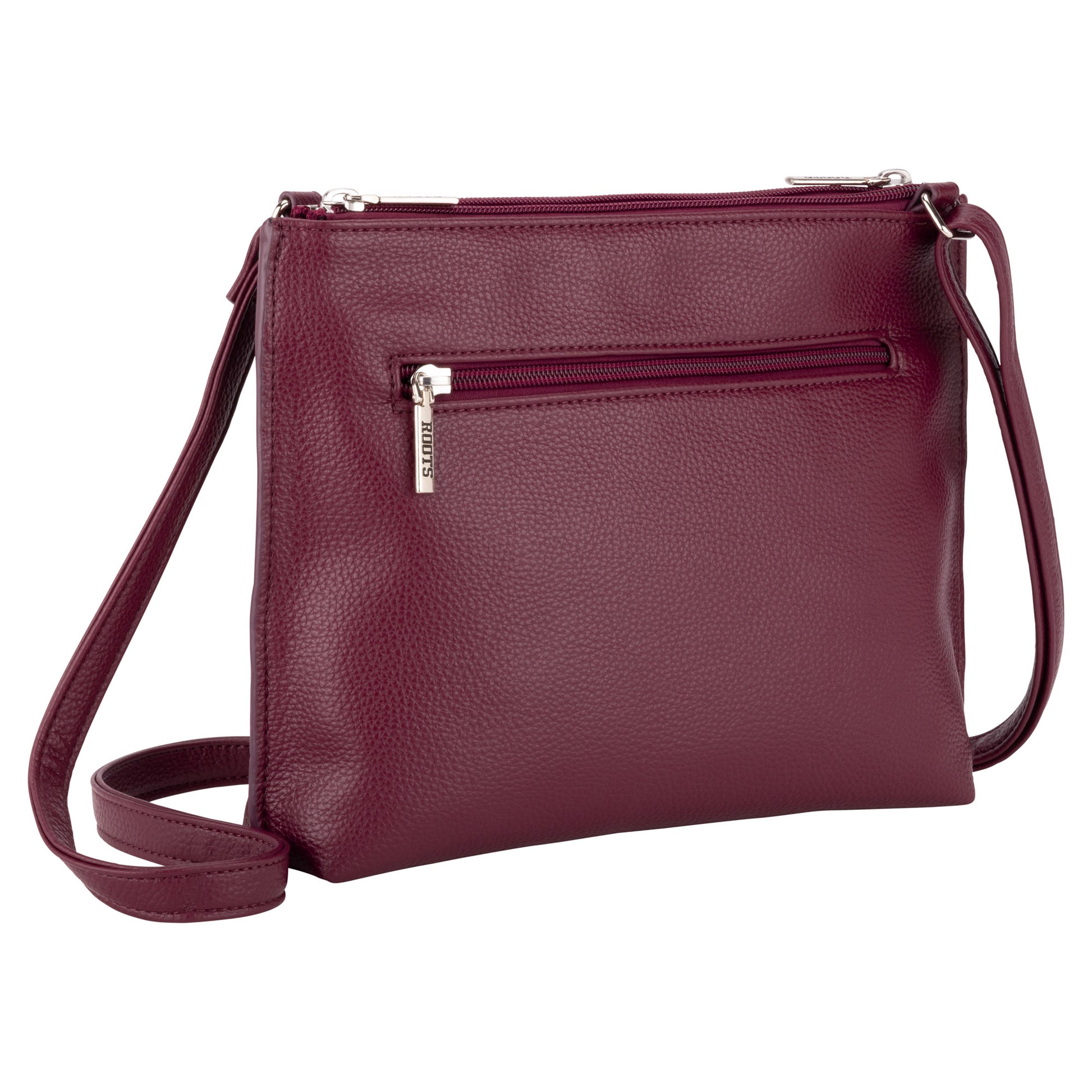 The Roots 3-Compartment Crossbody features a front zip pocket, adjustable strap, and smart organization.