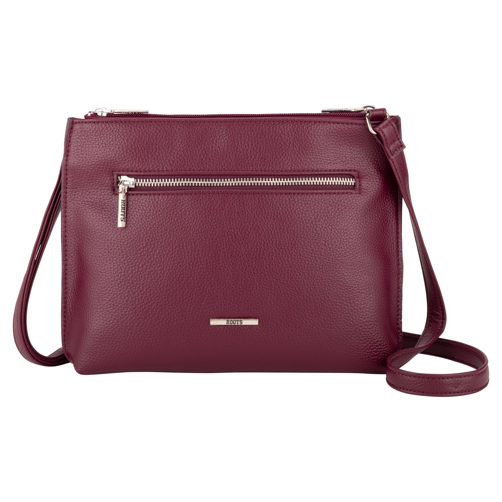 The Roots 3-Compartment Crossbody features a front zipper pocket and adjustable strap for easy organization.