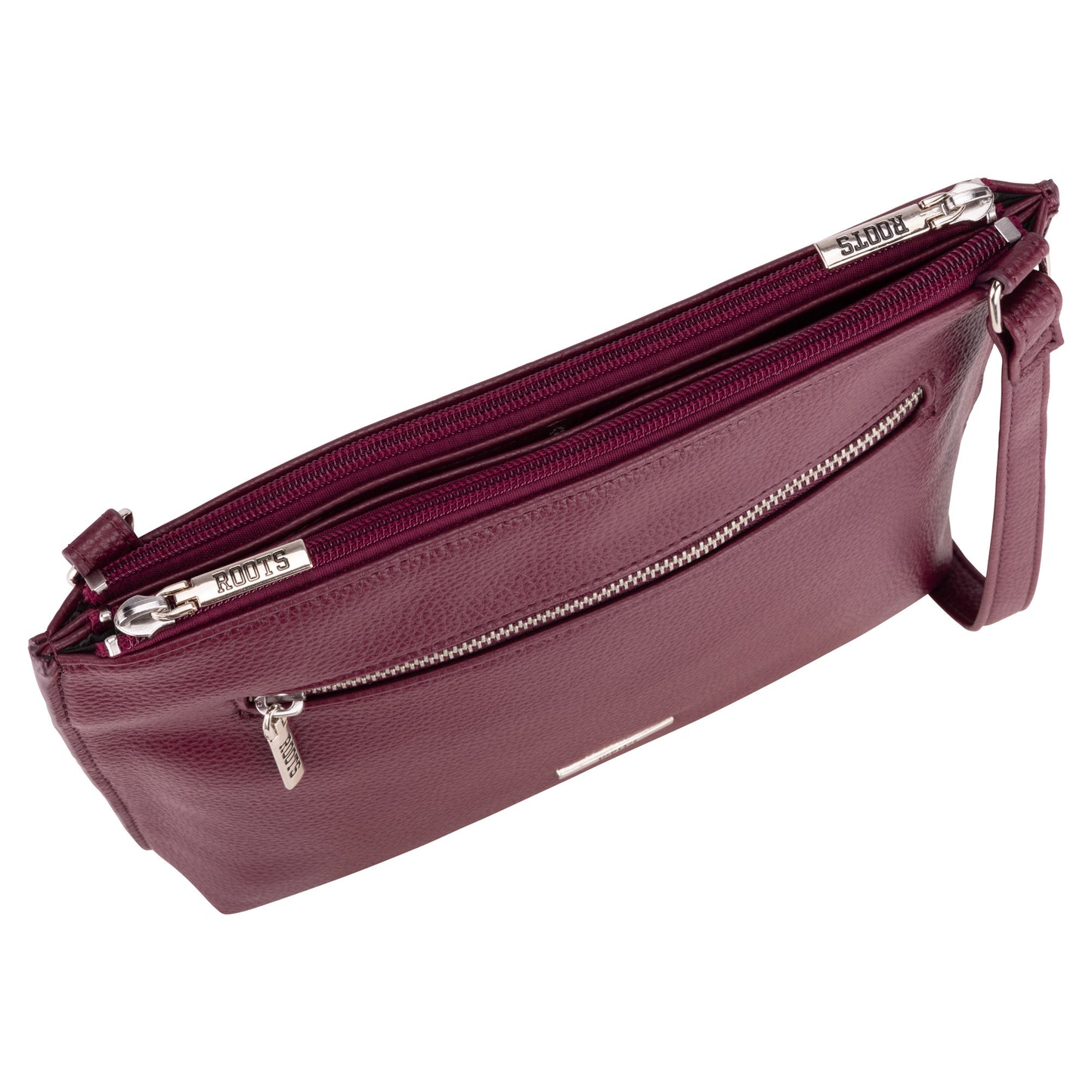 Roots 3-Compartment Crossbody by Roots in maroon, silver hardware, front zipper pocket, viewed from above.