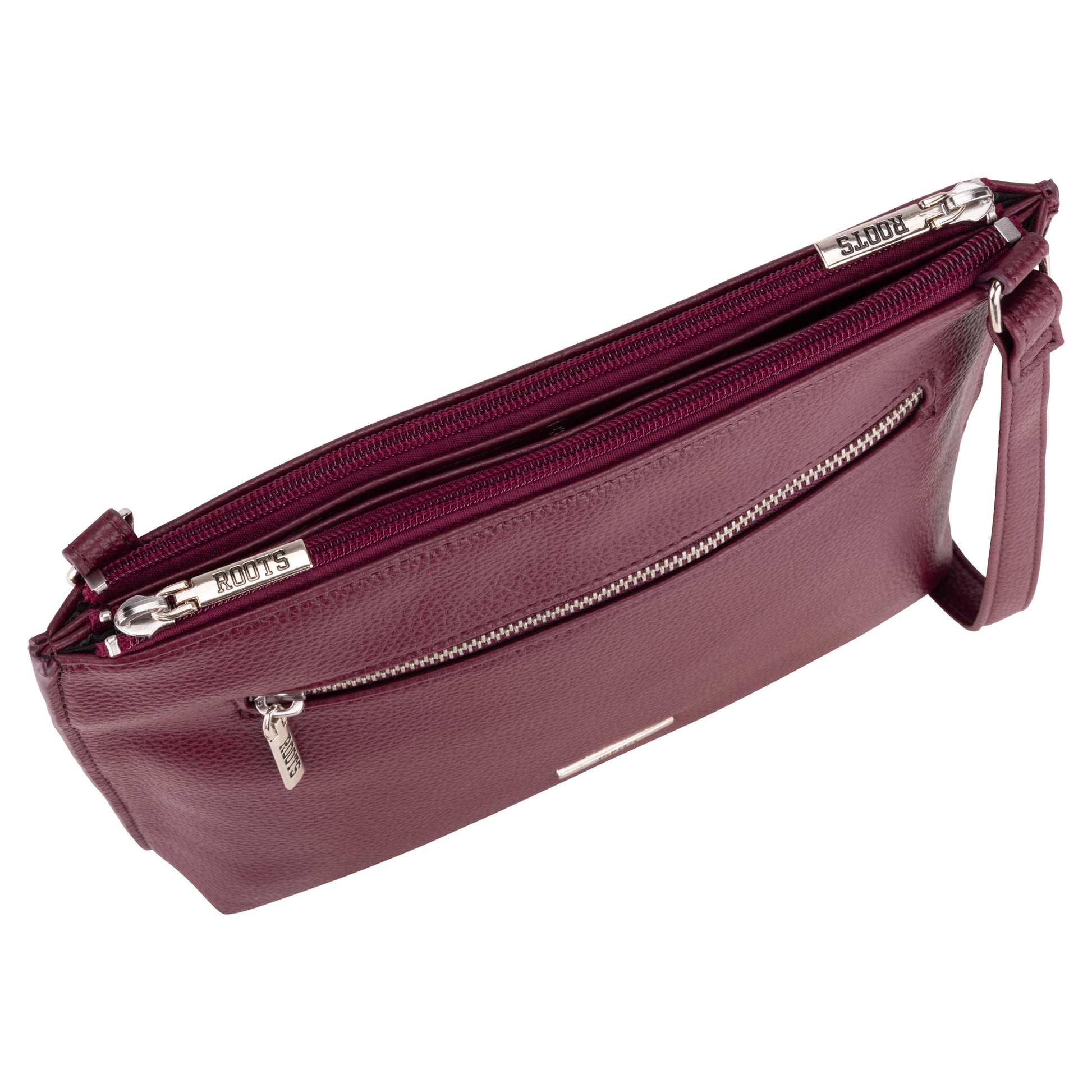Roots 3-Compartment Crossbody by Roots in maroon, silver hardware, front zipper pocket, viewed from above.
