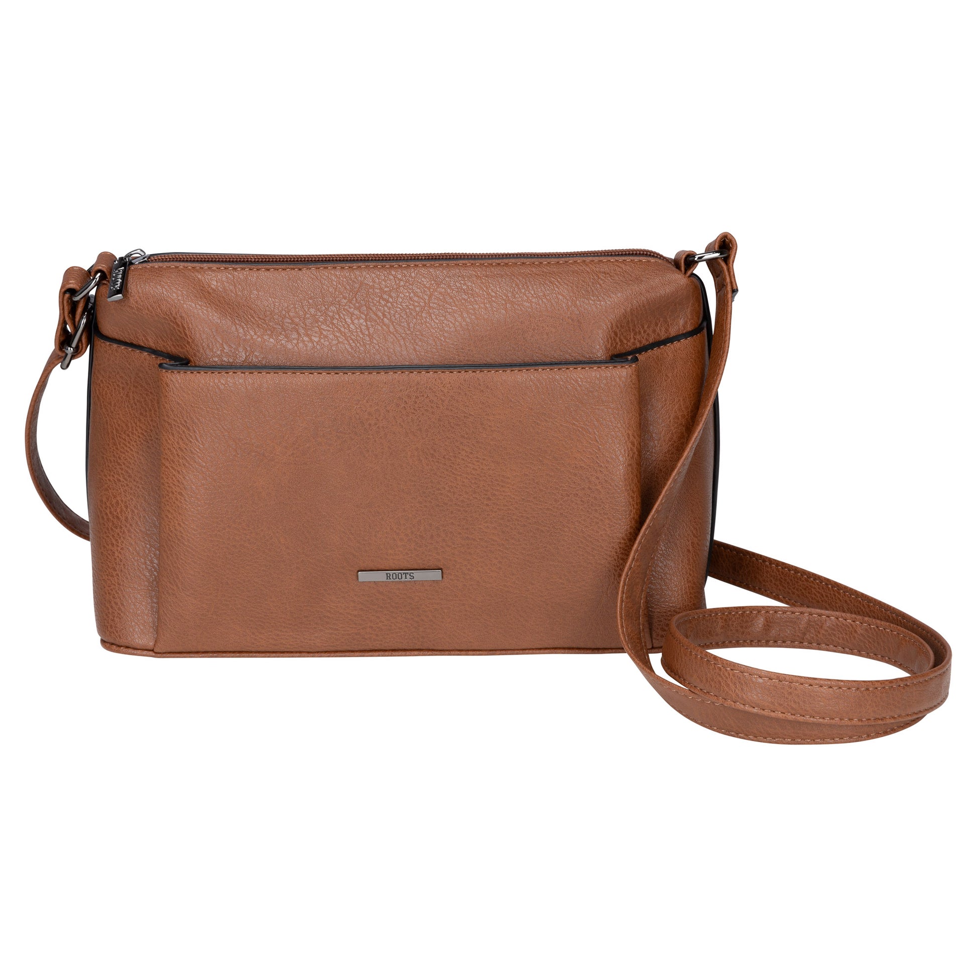 Roots Faux Leather Top Zip Crossbody with front pocket, silver logo plate & adjustable strap by Roots.