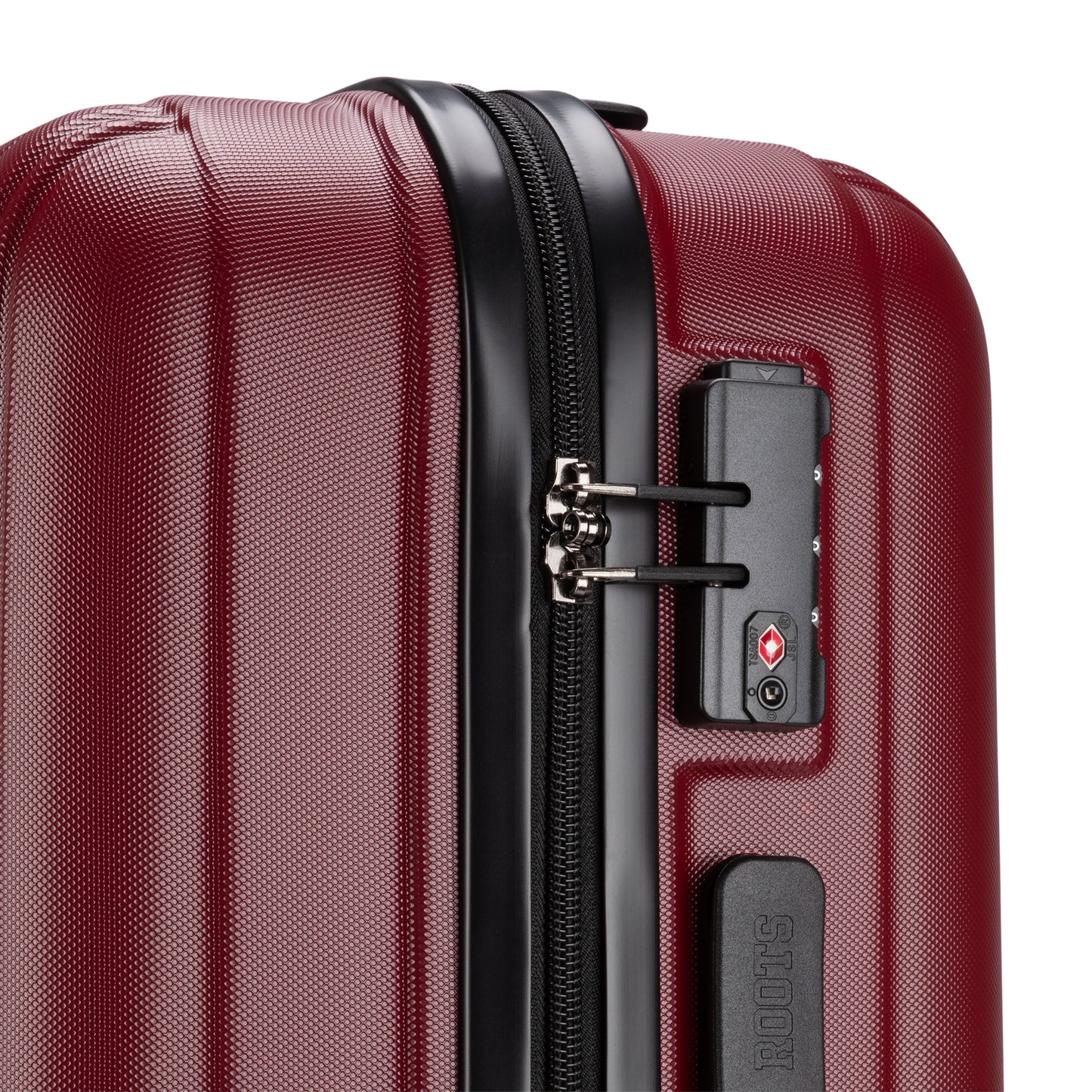 Close up of lockable zipper pulls and TSA lock on side of merlot Roots Identity 19" Hardside Spinner Carry-on