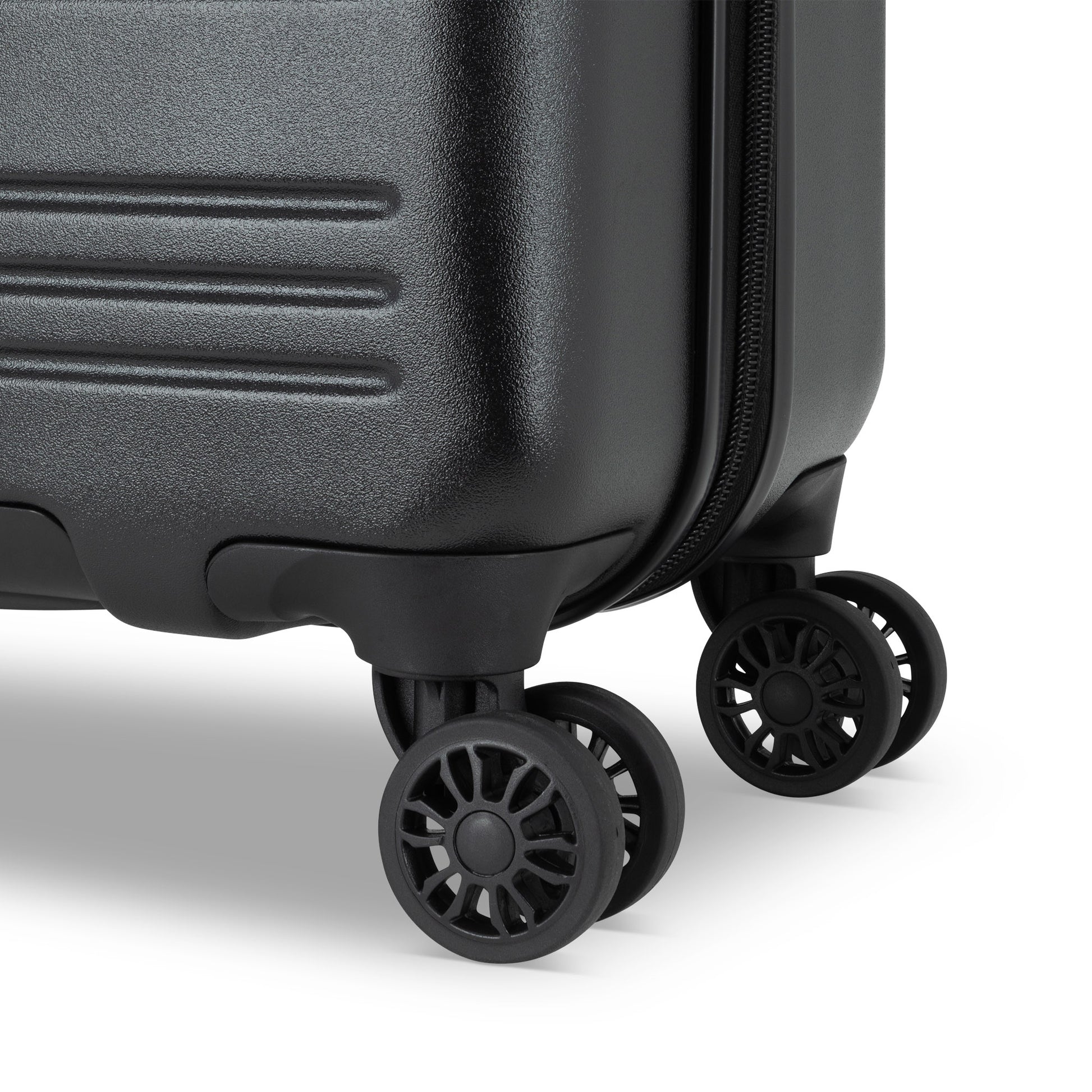 Close up of black spinner wheels on black Roots Chalet Hardside Spinner Carry-on