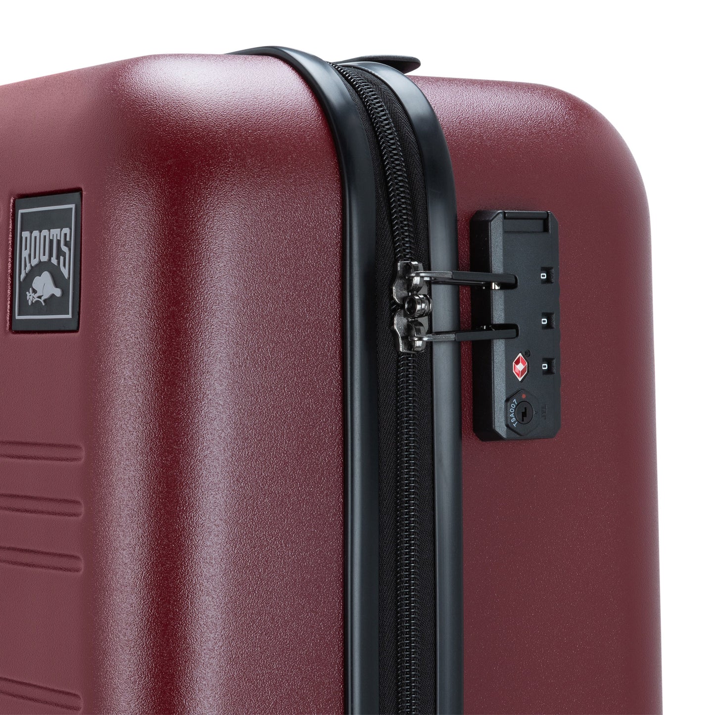 Close up of lockable zipper pulls fastened to built-in TSA lock on side of merlot red Roots Chalet Hardside Spinner Carry-on