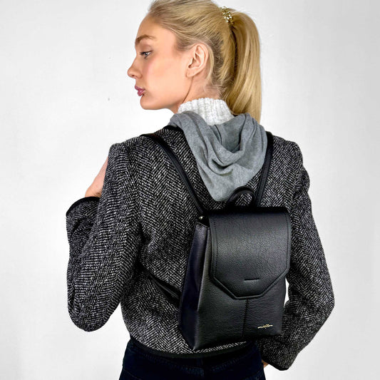 Product Image – Back view of a woman wearing black houndstooth jacket and the black Espe Robson Backpack