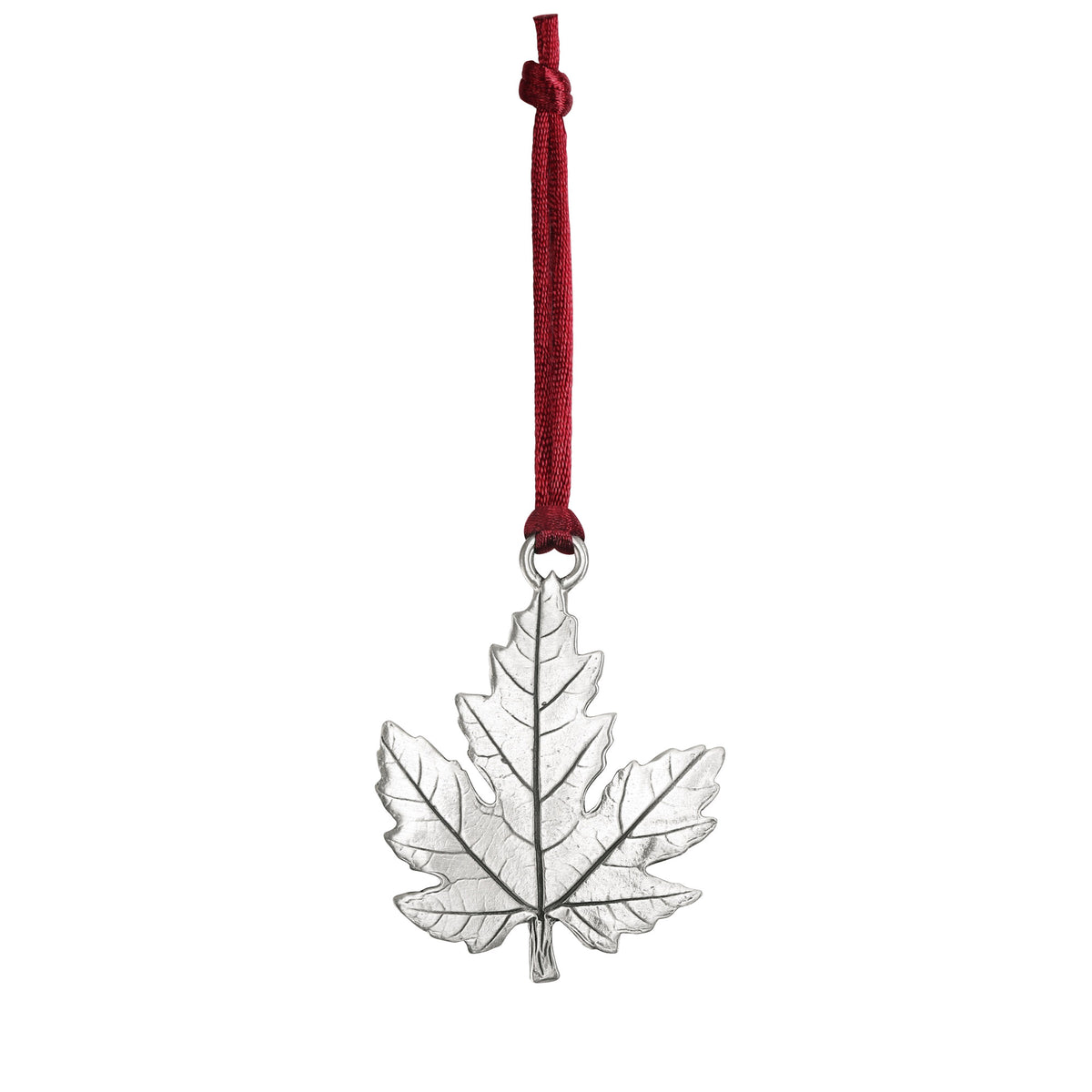Seagull Pewter Maple Leaf Ornament hanging from a red ribbon.