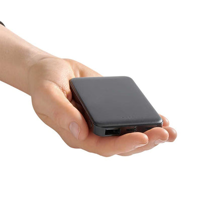 A hand holds the High Road Power Bank showing USB and micro USB ports for portable charging.