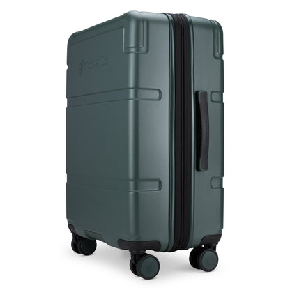 The Travelite Itinerary Medium Expandable Hardside Spinner in green, with 4 wheels and TSA lock, is shown.