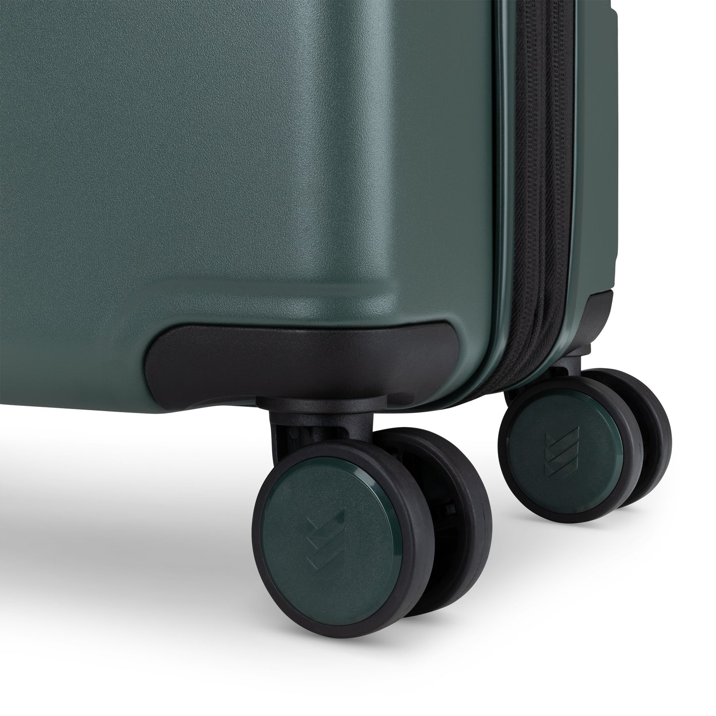 Close-up of two black and green spinner wheels on the Travelite Itinerary Large Expandable Hardside Spinner.