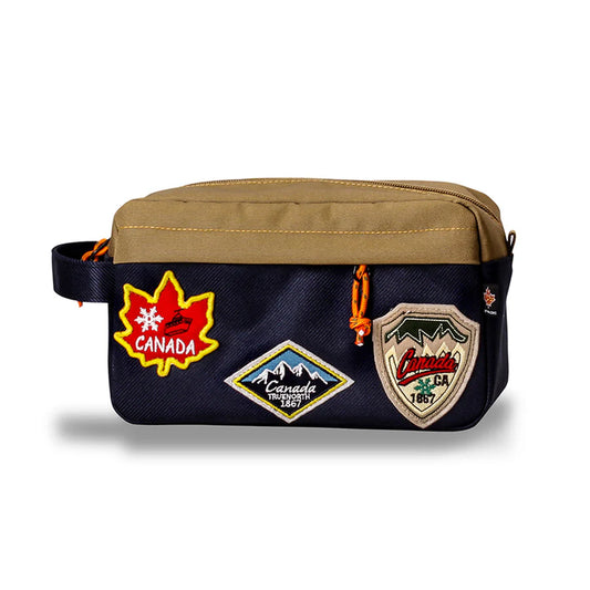 Product Image – Northern Icons Canada Travel Toiletry Bag with brown top, navy bottom, side handle, and Canada patches.