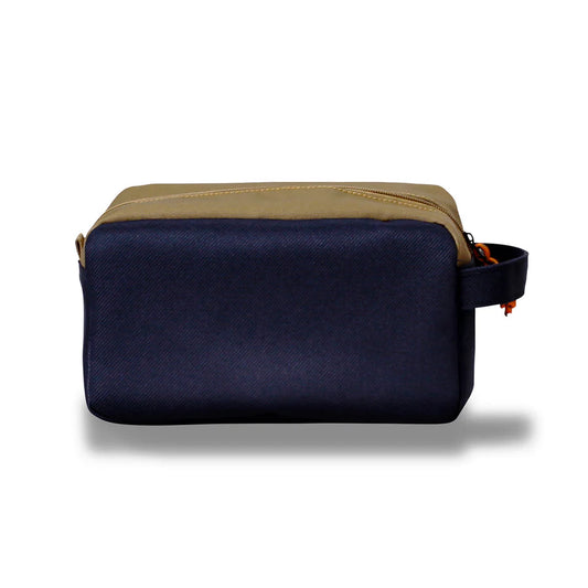 Product Image – Northern Icons Canada Travel Toiletry Bag: tan top, navy sides, side handle; shown on white background.