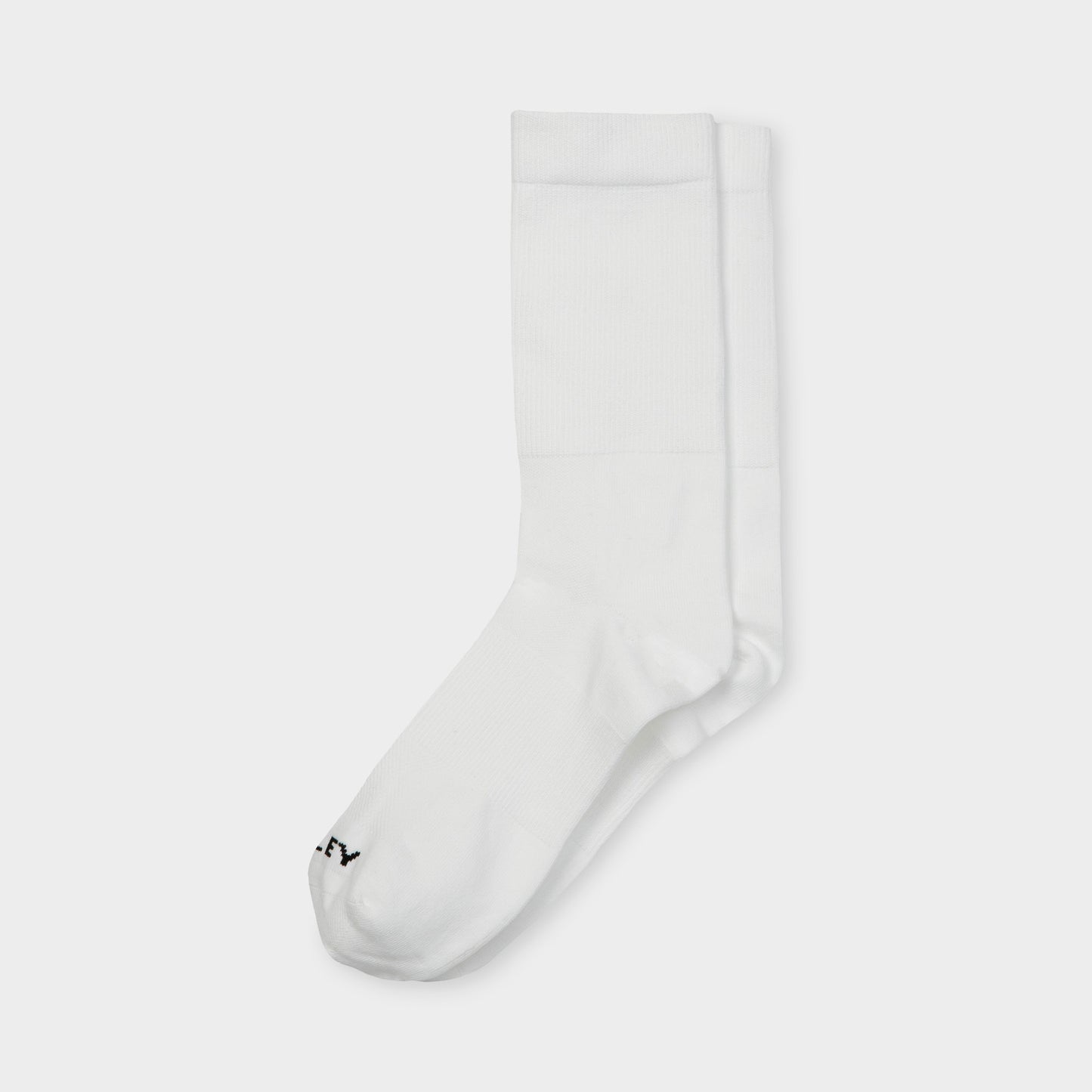 Tilley Mid Calf Travel Sock in white with black logo, moisture wicking. Tilley brand. ONLINE ONLY.