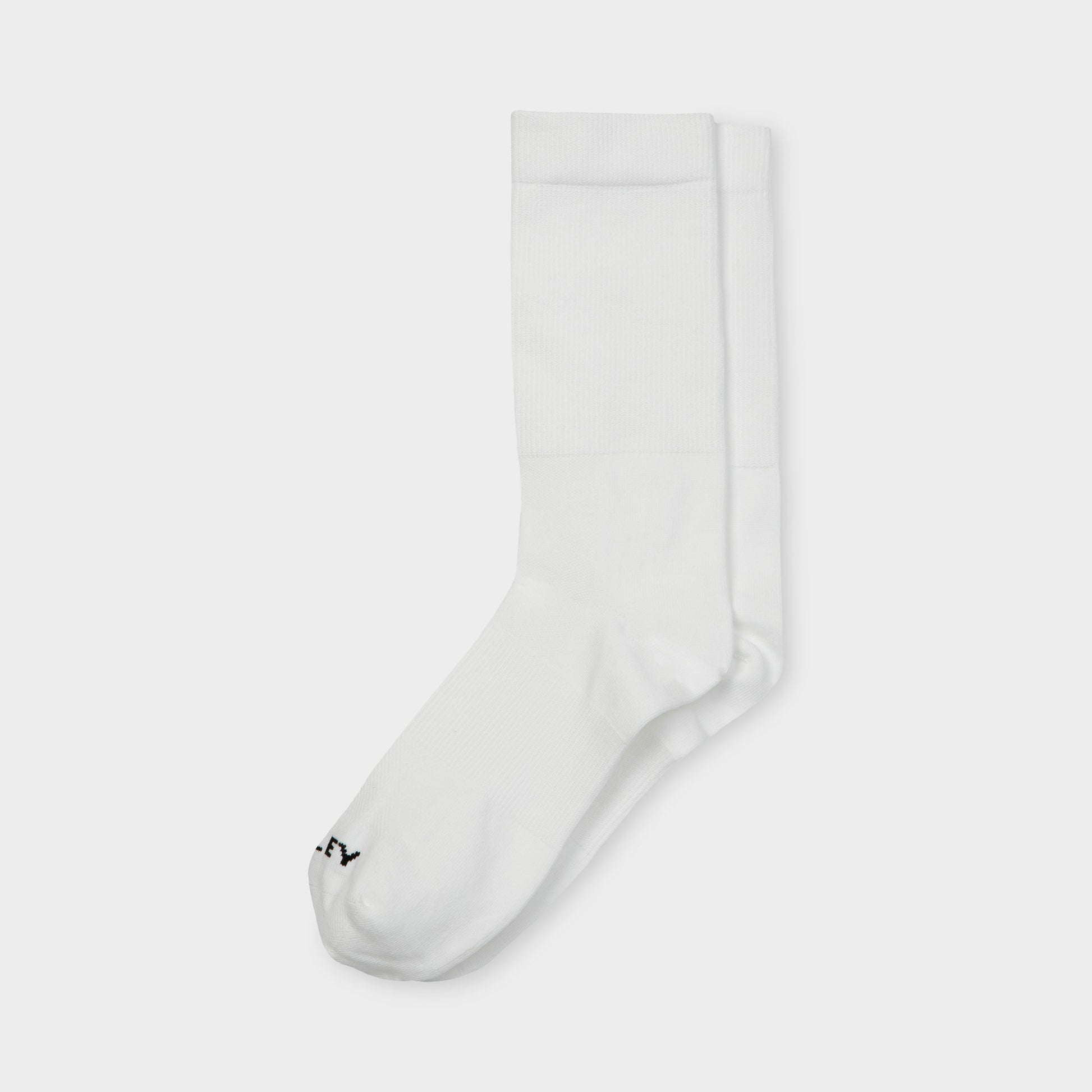Tilley Mid Calf Travel Sock in white with black logo, moisture wicking. Tilley brand. ONLINE ONLY.