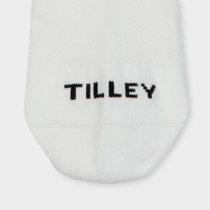 Tilley Ankle Travel Sock—white, moisture-wicking with "TILLEY" stitched in black near the toe.