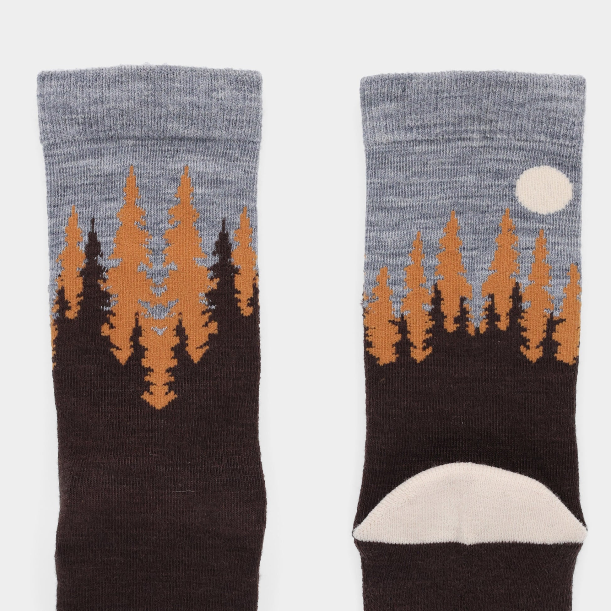 Tilley Landscape Sock: Gray and brown merino socks with forest, orange trees, and a moon on the ankle. ONLINE ONLY.