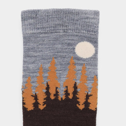 Tilley Landscape Sock: gray merino, pine tree print, blue sky, odour eliminating—ONLINE ONLY.