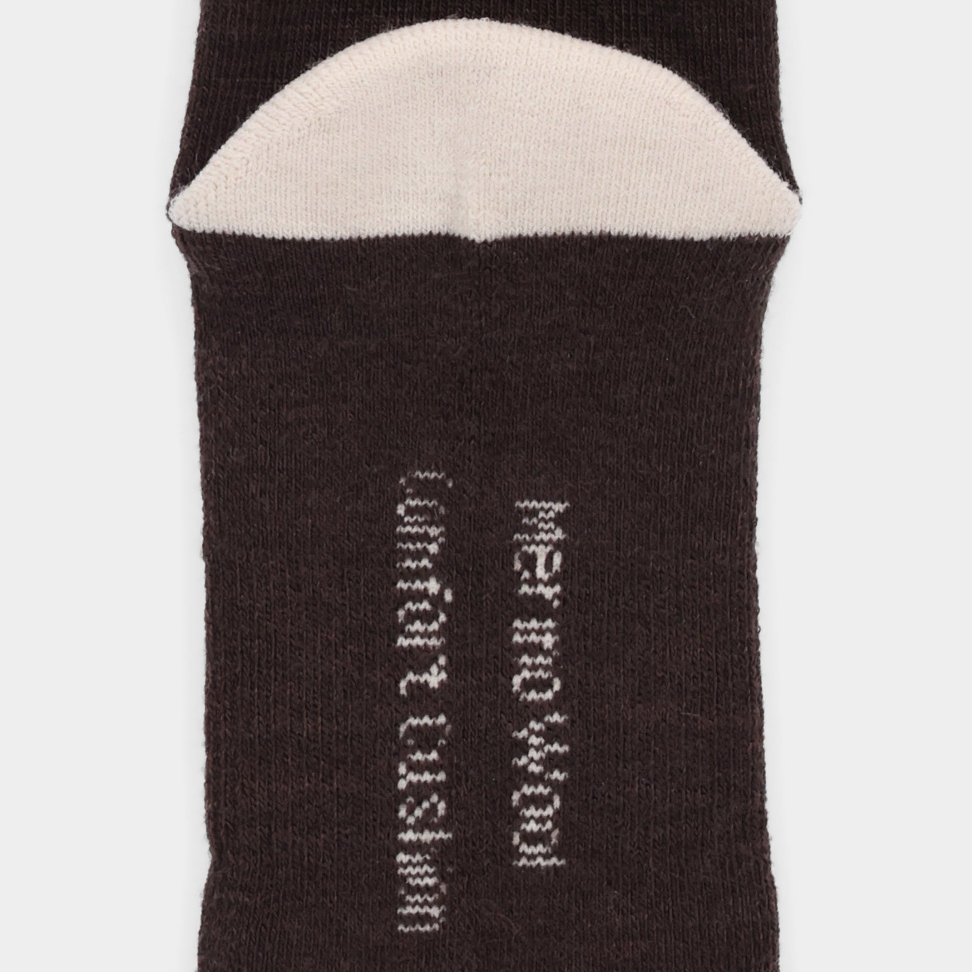 Close-up of Tilley Landscape Sock—ONLINE ONLY; dark merino with white toe and odour eliminating text.