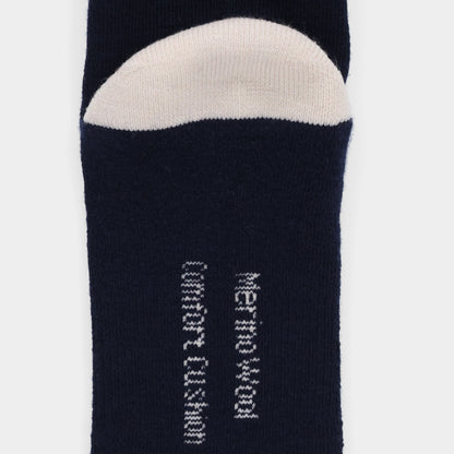 Close-up of Tilley Landscape Sock - ONLINE ONLY in navy blue with white toe and vertical moisture wicking text.