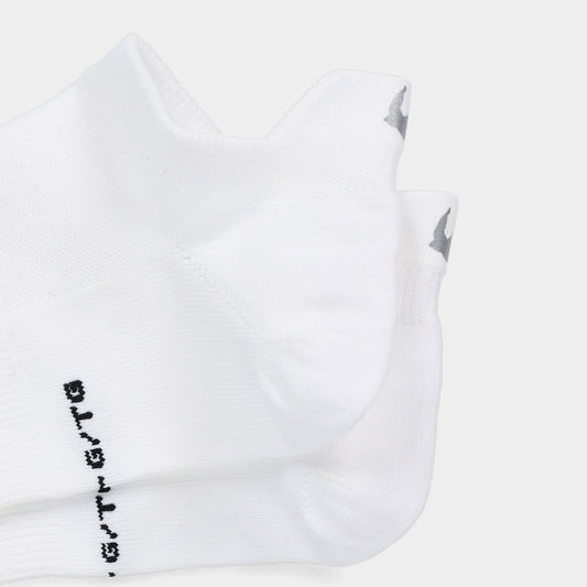Product Image – Two pairs of Tilley Tab Travel Socks in white with arch support and gray logo, shown on a plain background.