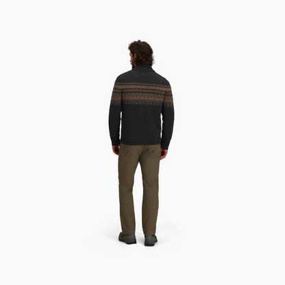 Man wears Royal Robbins Men's Arch Rock 1/4 Zip sweater, khaki pants, and gray shoes against a white background.