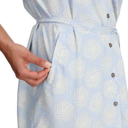 Hand reaching into side pocket of Royal Robbins Women's Camino Pucker Dress in light blue pattern.