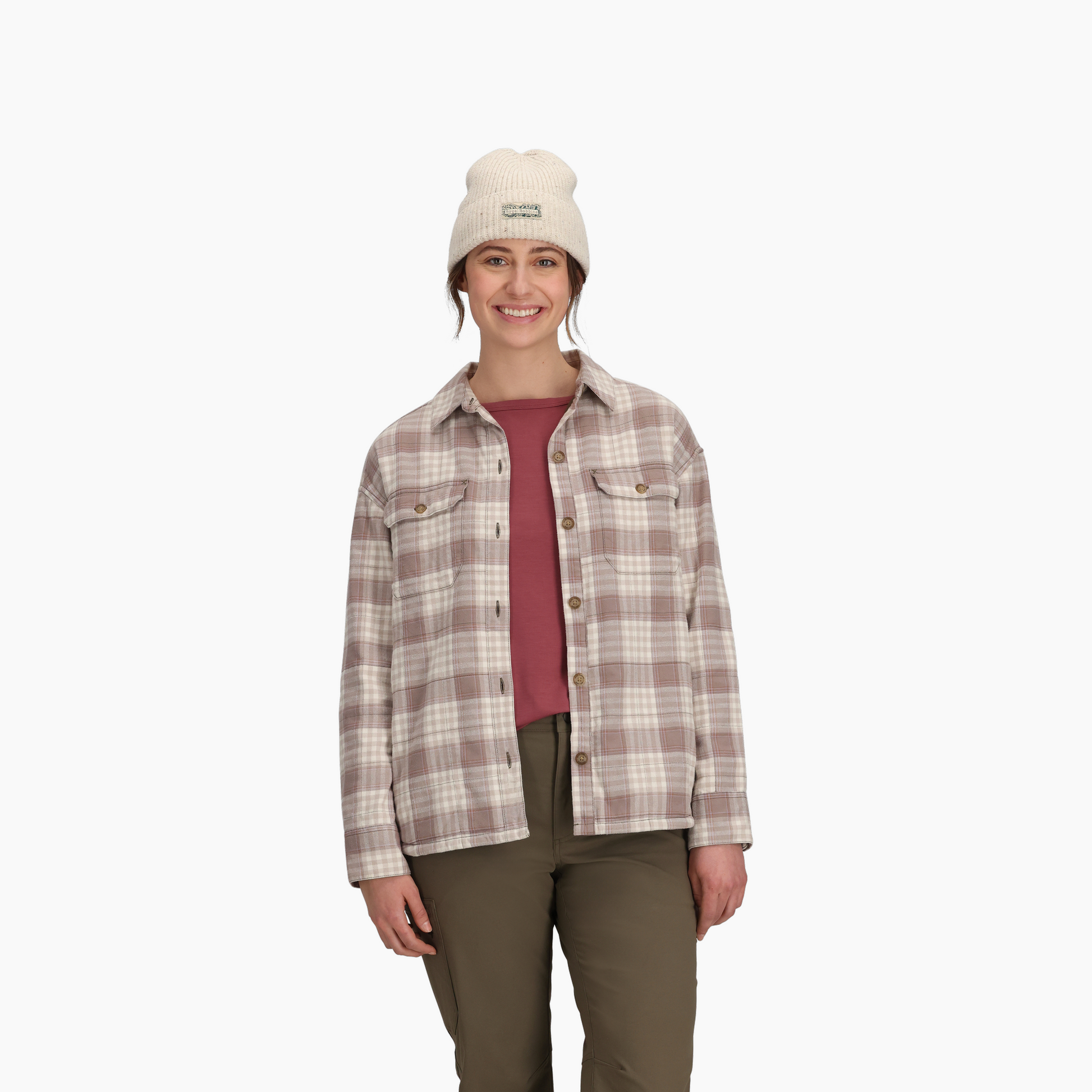 Woman wearing Royal Robbins Women's Vista Flannel Shacket, cream beanie, maroon shirt, and olive pants.
