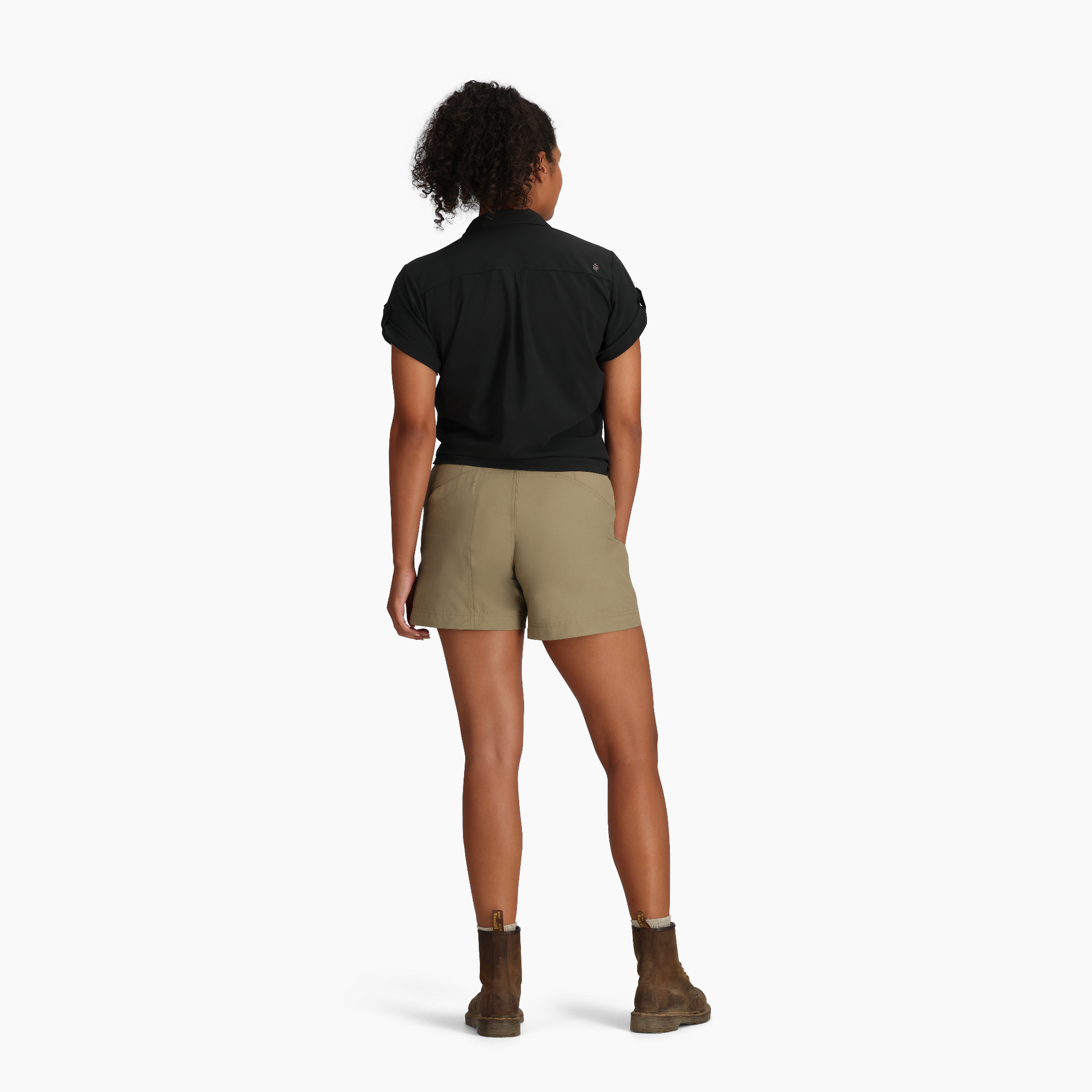 Person stands with back to camera wearing Royal Robbins Women's Spotless Evolution Meadow SS shirt on white background.