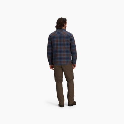 Man in Royal Robbins Men's Snowcap Lined Flannel stands with back to camera, against a white background.
