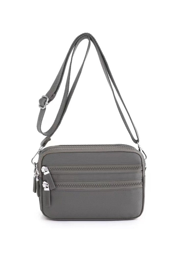 Alina's Triple Zip Square RFID Crossbody in grey, front view.