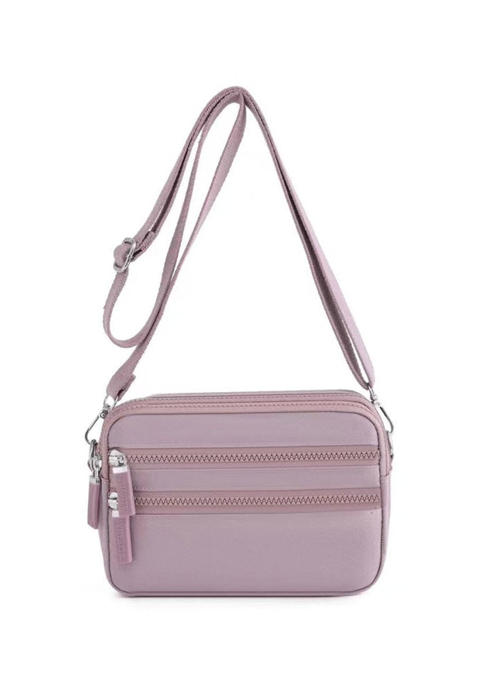 Alina's Triple Zip Square RFID Crossbody in rose, front view.