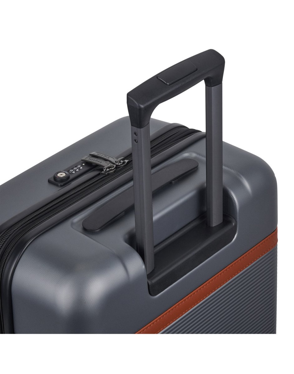 Bugatti Wellington Hardside 24" Expandable Spinner in Pewter colour, close-up view  showing the TSA combination lock and telescopic trolley handle.