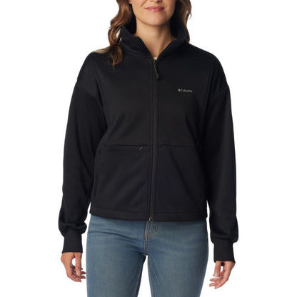 Woman wearing blue jeans and Columbia Women's Boundless Trek™ Tech Full Zip Jacket in black, zipped up, front view