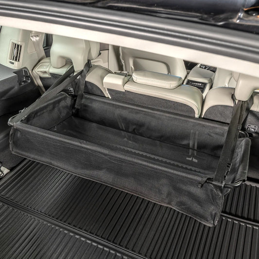 Product Image – Lifestyle image of High Road® CargoStash™ Storage Shelf, positioned inside the trunk of a car.