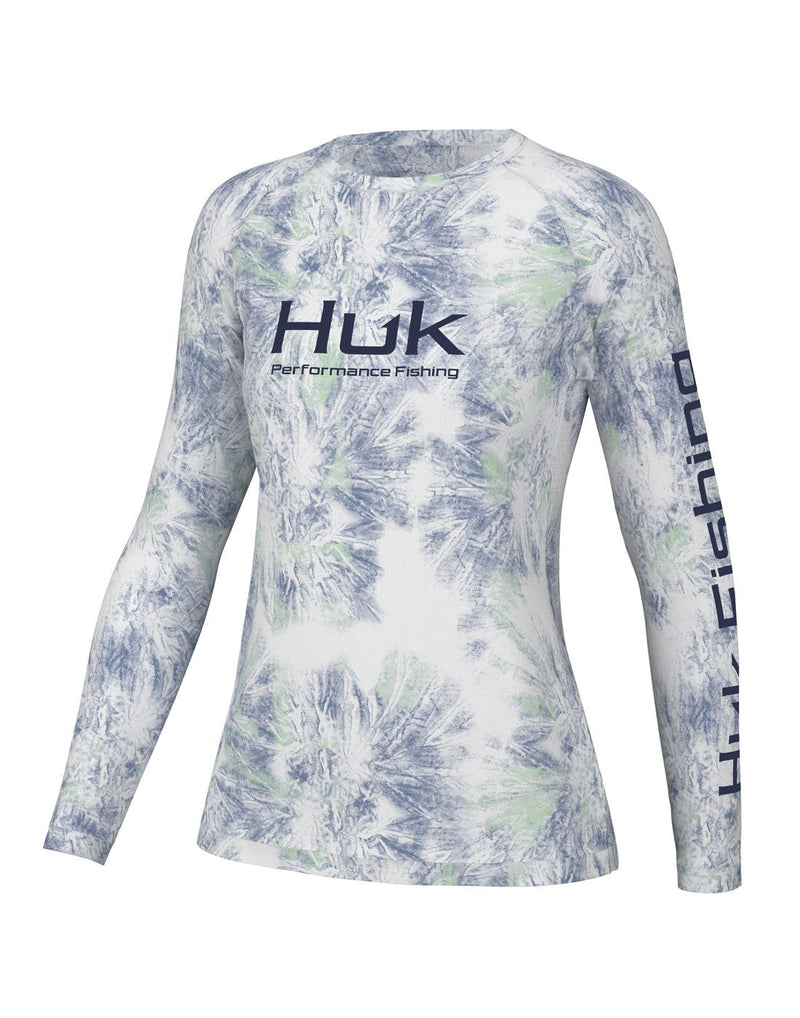 Front view of the Huk Women's Pursuit Performance Shirt in Aqua Dye White colour. Huk logo printed across chest and "Huk Fishing" along outside length of left sleeve.