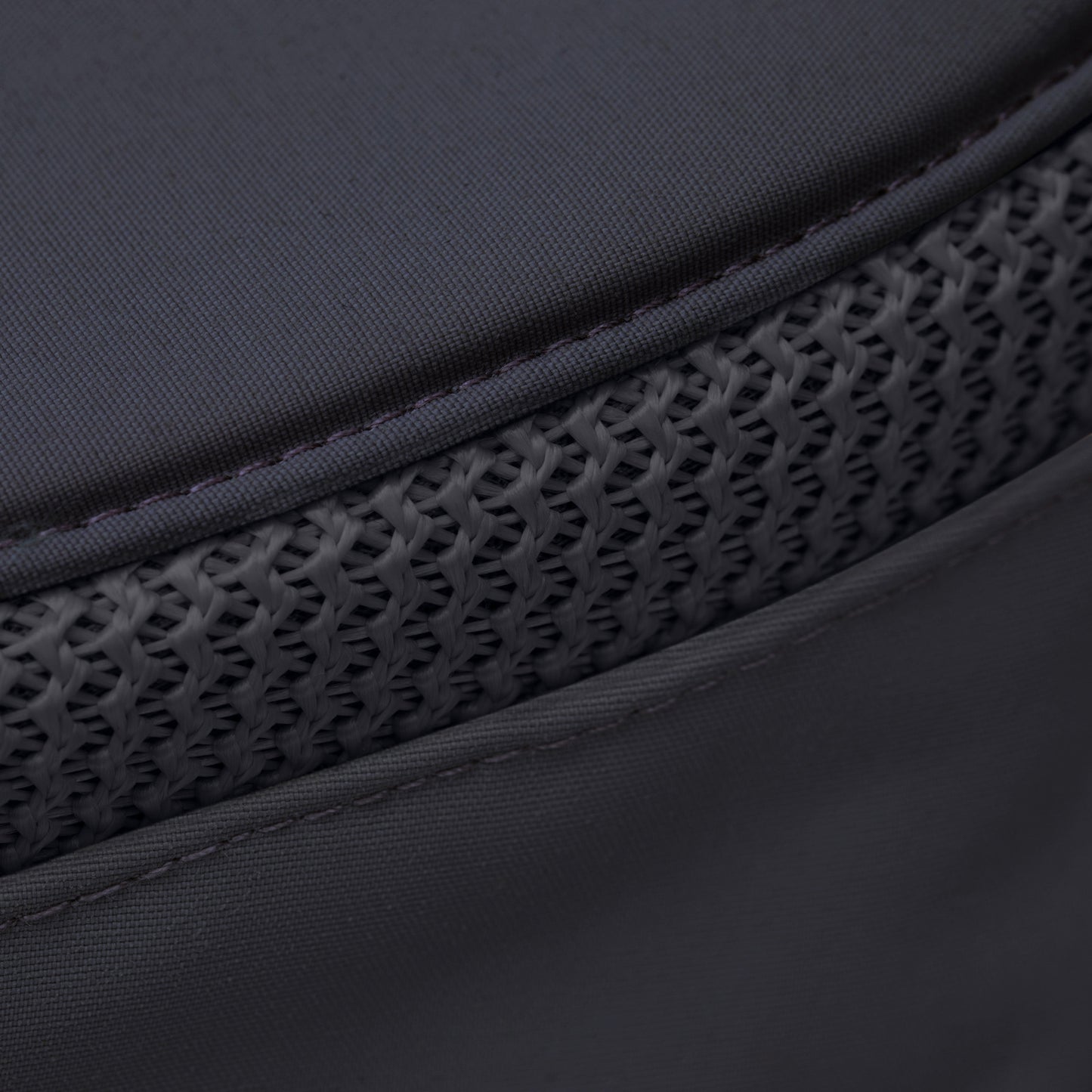 Close-up of Tilley LTM6 Airflo® Hat's dark gray recycled nylon with a textured, mesh-like horizontal strip.