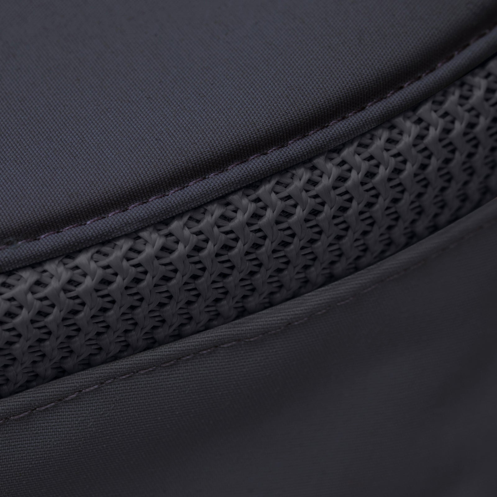 Close-up of Tilley LTM6 Airflo® Hat's dark gray recycled nylon with a textured, mesh-like horizontal strip.