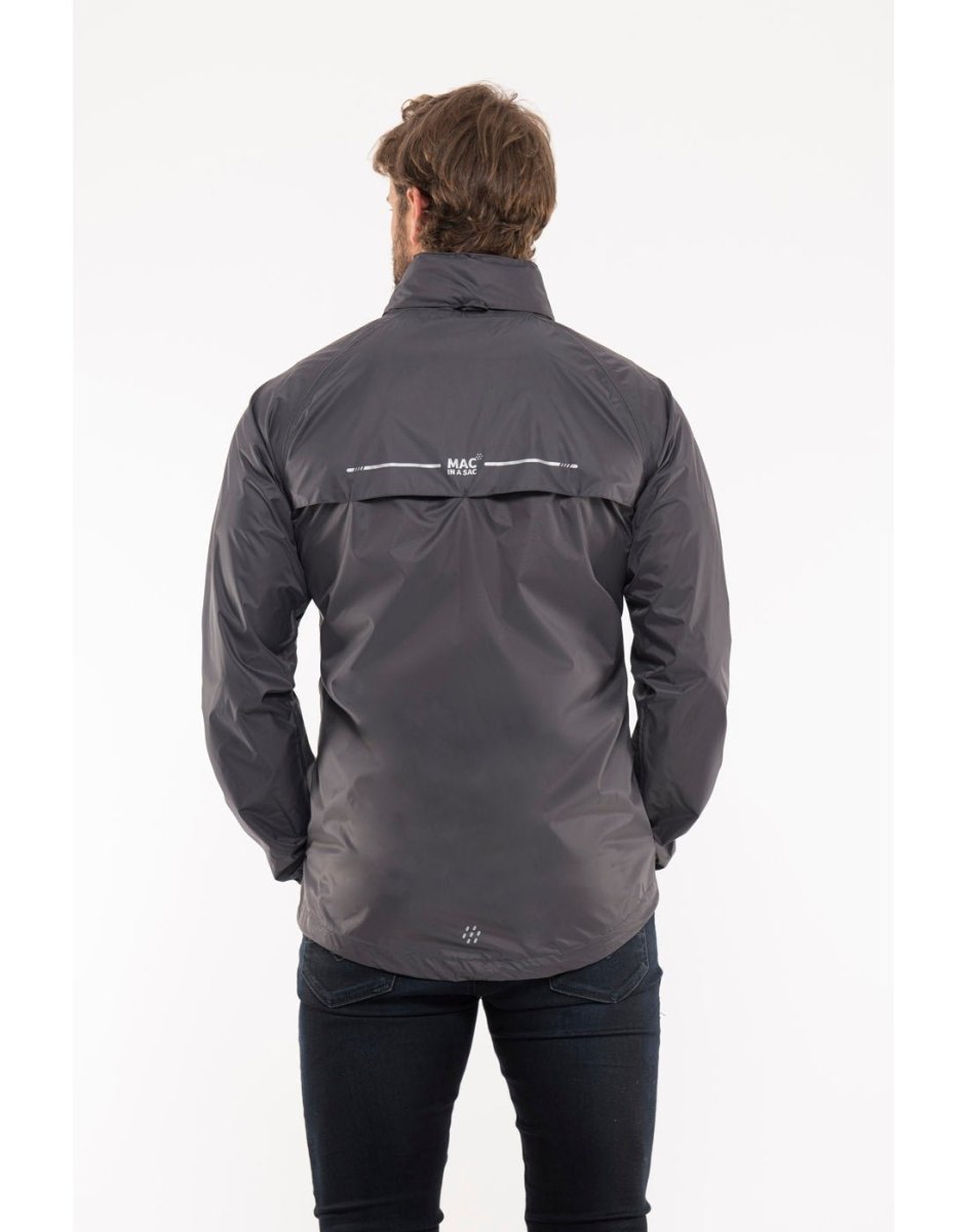 Man wearing Mac in a Sac Origin II Packable Waterproof Jacket in charcoal, back view.