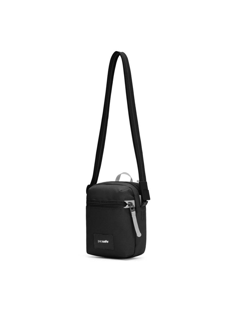 Pacsafe® GO Anti-Theft Micro Crossbody in jet black colour, front right side view with cut-resistant strap extended.