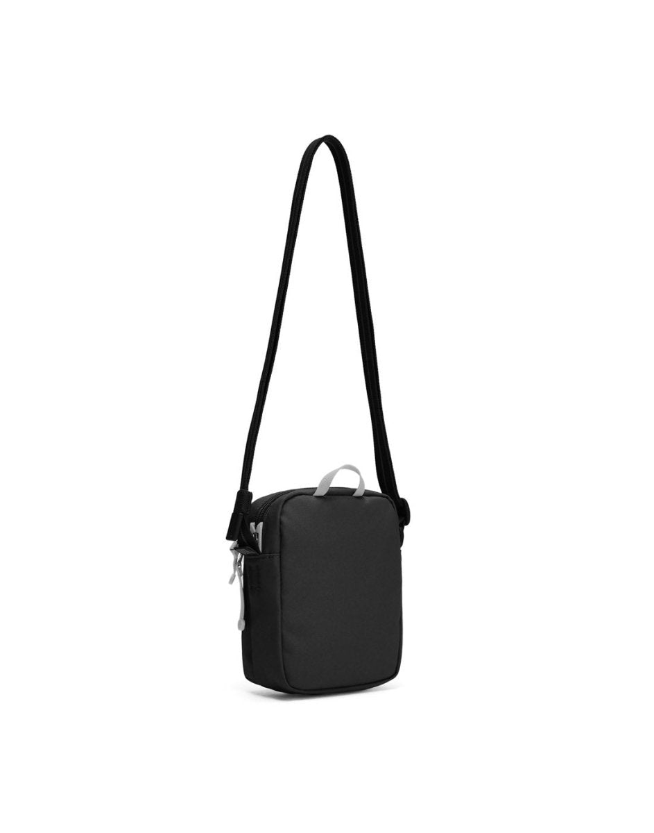 Pacsafe® GO Anti-Theft Micro Crossbody in jet black colour, back view with cut-resistant strap extended.