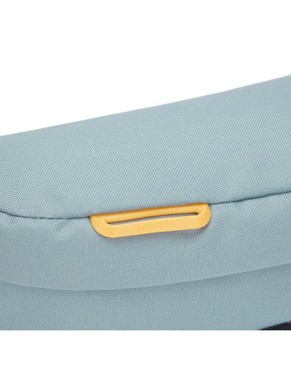 Pacsafe® GO Anti-Theft Sling Pack in fresh mint colour, close up of external attachment point for small items.