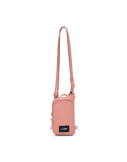 Pacsafe® GO Anti-Theft Tech Crossbody in rose colour front view with Carrysafe® slashguard strap extended.