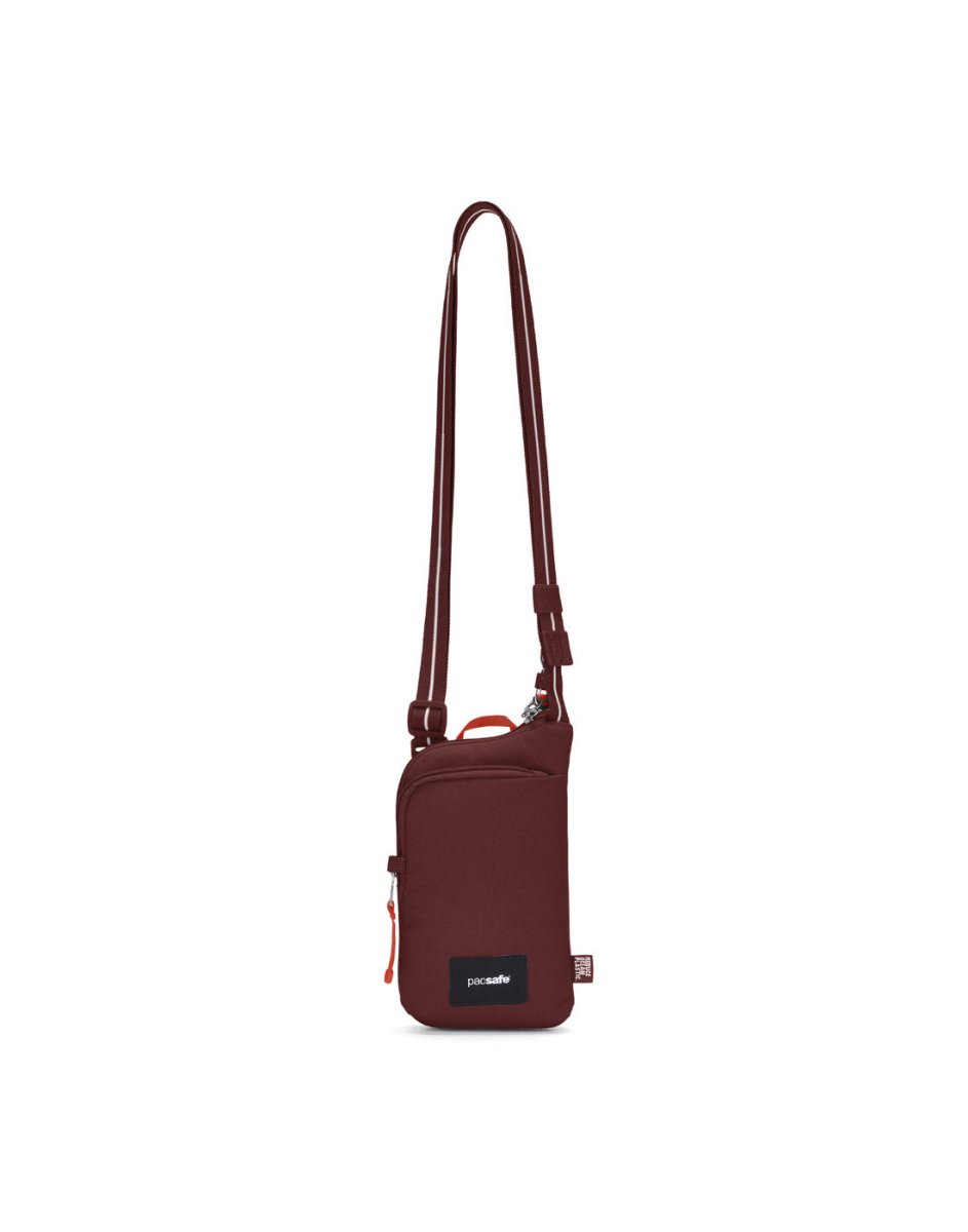 Pacsafe® GO Anti-Theft Tech Crossbody in garnet red, front view with Carrysafe® slashguard strap extended.