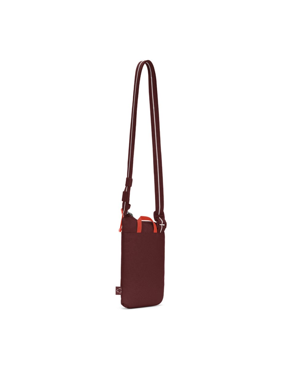 Pacsafe® GO Anti-Theft Tech Crossbody in garnet red, back angled view with Carrysafe® slashguard strap extended.