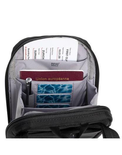 Pacsafe® RFIDsafe™ RFID Blocking Tech Crossbody, black, interior view of RFID slip pocket with boarding pass and passport inside, and pen in pen loop and cards in three card slots