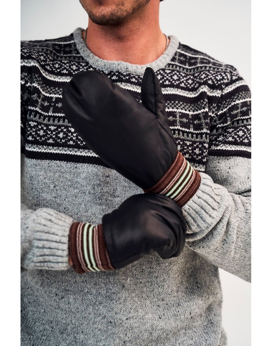 Lifestyle image of man wearing a grey and black knit sweater and the Raber Garbage mitts in black